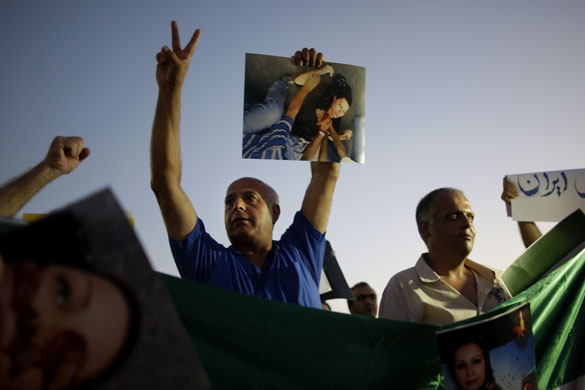 24 hours in pictures: Israelis of Iranian origin hold signs showing Neda Agha Soltan