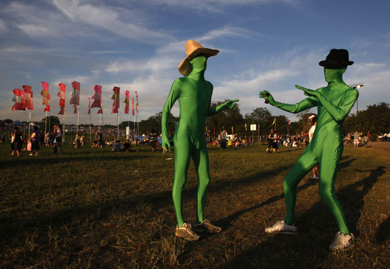 Glastonbury day two: Festival goers dressed in costume react Glastonbury Festival 2009