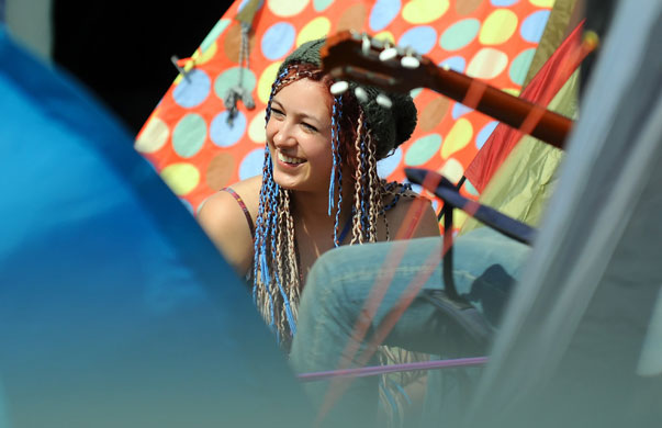 Glastonbury day two: Glastonbury festival 2009 A girl sits among the tents