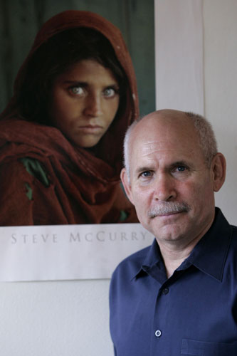 Week in Business: Photographer Steve McCurry with his Kodrachrome photo of an Afghan girl