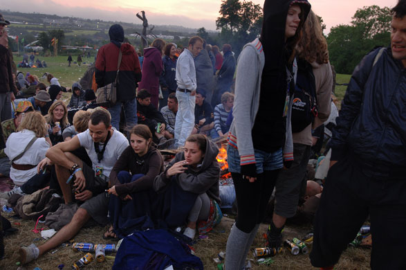 First day at Glastonbury: Revellers by a bonfire, sunrise at the stone circle at the Glastonbury