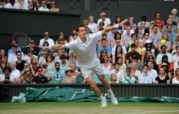 Thursday Wimbledon: Andy Murray at full stretch to make a forehand return