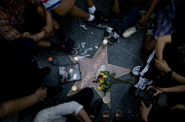 Michael Jackson reaction: Los Angeles, US: Fans of sit by his star on the Hollywood Walk of Fame