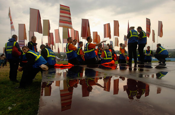 24 Hours: Glasto Weather: Security officers meeting on patrol Glastonbury 2009