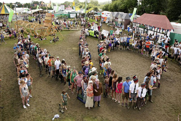 Glastonbury crowds: Glastonbury crowds greenpeace protest human no