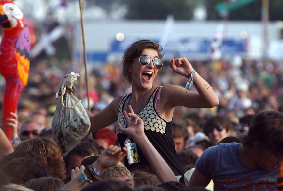 Glastonbury crowds: Glastonbury crowds woman cheers lady gaga