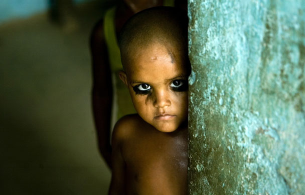 28 June 2009: Allahabad, India: A child with 'Kajal' applied to his eyes