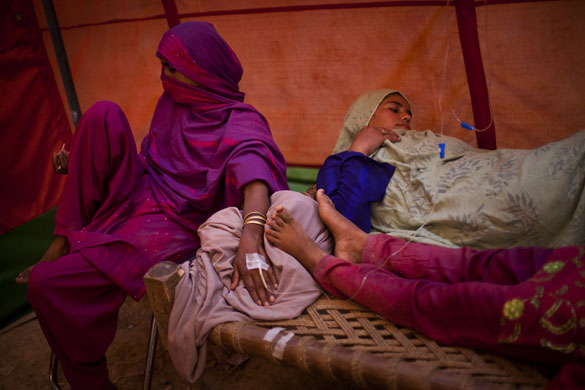 28 June 2009: Mardan, Pakistan: Refugee women are treated in a hospital