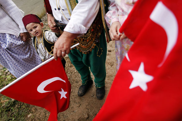 29 June 2009: Prusac, Bosnia And Herzegovina: Bosnian Muslims hold Turkish flags