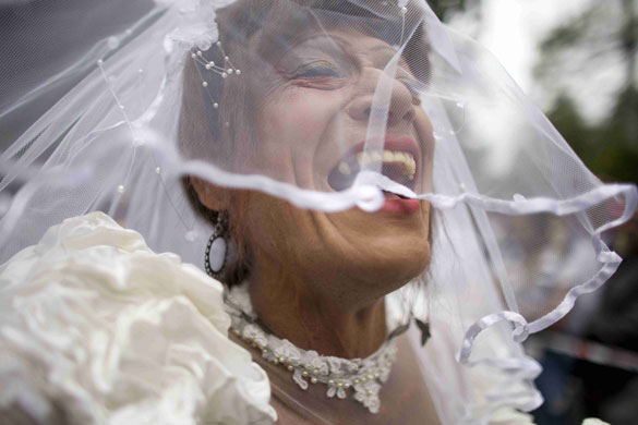29 June 2009: Bogota, Colombia: A reveler dressed as a bride during a Gay Pride parade