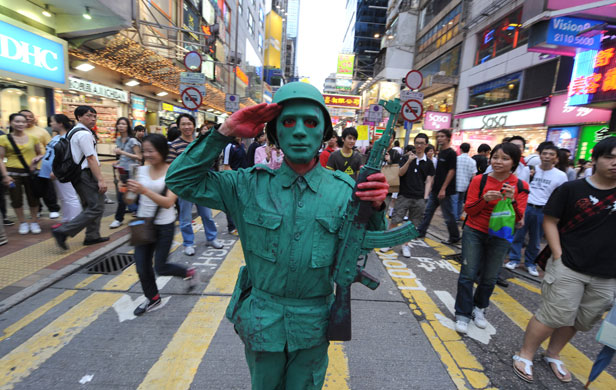 3 June 2009: Hong Kong, China: A man dressed as a Chinese PLA soldier