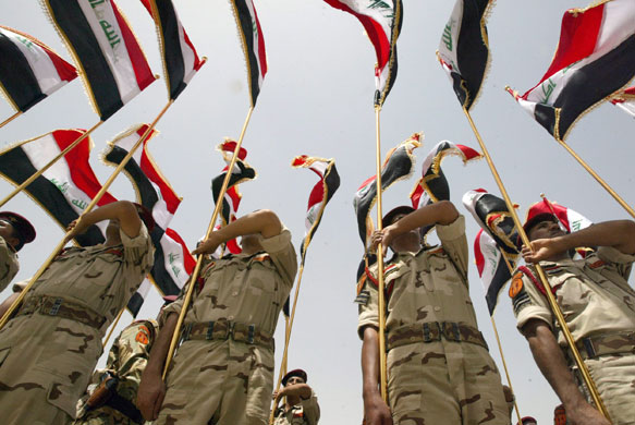 Iraqi army handover: Iraqi soldiers take part in a parade