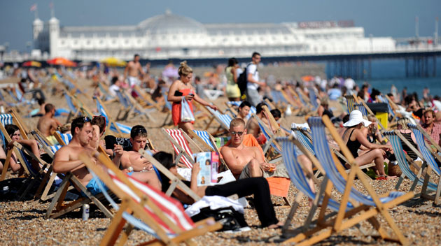 UK weather update: Beach goers enjoy the sun in Brighton