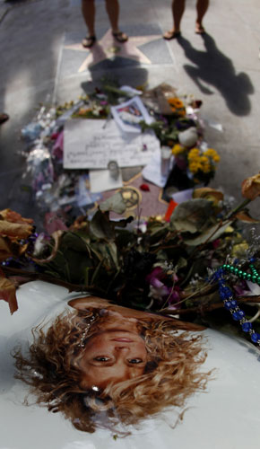 24 hours in pictures: Fans stop at Farrah Fawcett's star on the Hollywood Walk of Fame