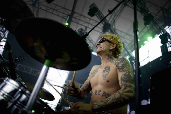 24 hours in pictures: David Viola, drummer of the funk group IRA  during Colombia Rock Festival