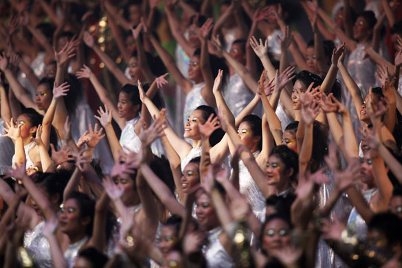 24 hours in pictures: erformers dance at the opening ceremony of  the first Asian Youth Games