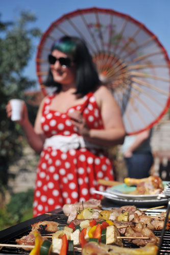 Week in Business: A woman relaxes at a barbecue. 