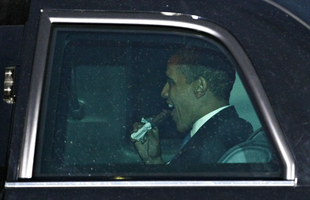 Obama in Germany: President Barack Obama eats a snack in his limousine in Dresden