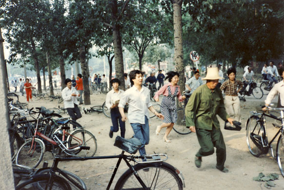 Tiananmen protests 1989: Civilians flee from gunfire at intersection of Fuxing and Wanshou Roads