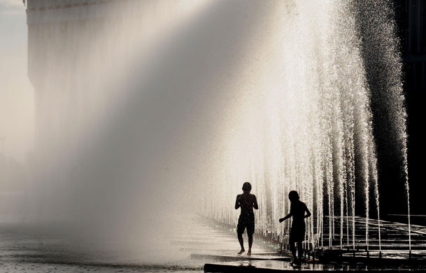 24 hours: Children cool off in fountains during hot weather in Almaty, Kazakhstan