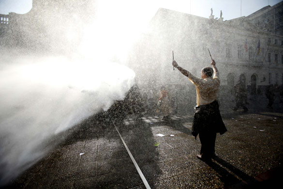 24 hours: A teacher is hit by a police water cannon during a protest in Santiago