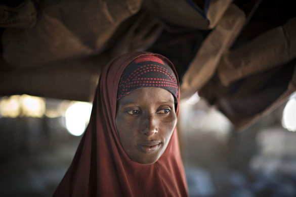 24 hours: A Somali refugee waits in line for food handouts 