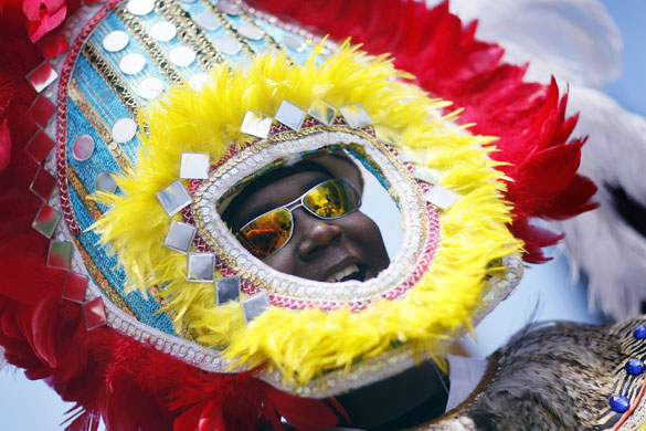 24 hours in pictures: Coconut Grove, Florida, USA:  A dancer participates in the Junkanoo parade