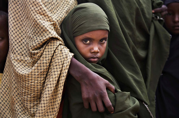24 hours in pictures: Somali refugee girl waits to be registered by UNHCR in Kenya