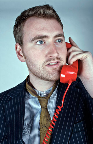 Michael Clough Portfolio: 'The Red Telephone' portrait shot of man on old fashoined phone