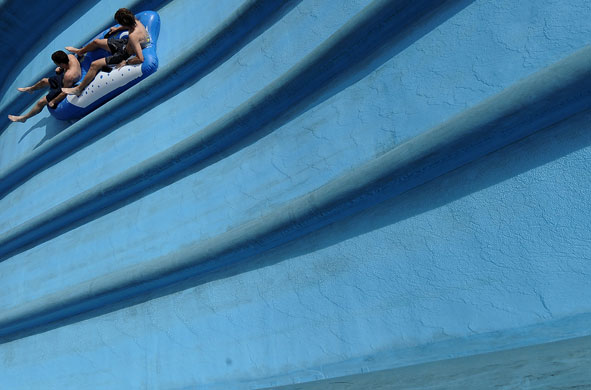 9 June 2009: Liptovsky Mikulas, Slovakia: Young boys on a toboggan at a water park