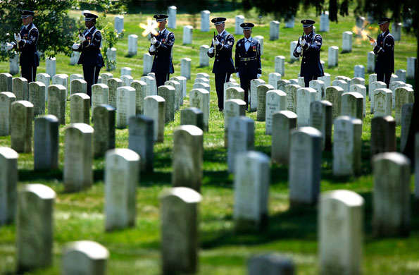 1 July 2009: Arlington, UK: A military firing party fires during a funeral