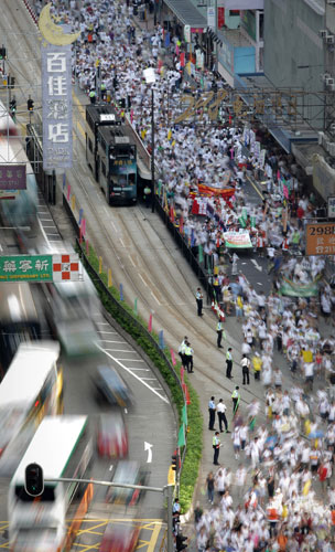 1 July 2009: Hong Kong, China: People during a pro-democracy march
