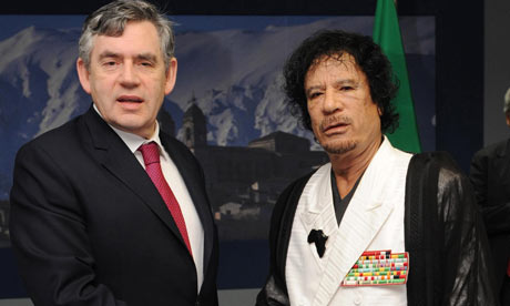 Gordon Brown with Muammar Gaddafi at the G8 Jamboree in Italy.  