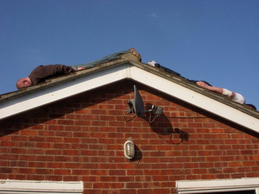 Facedown: Facebook lying down game on a roof