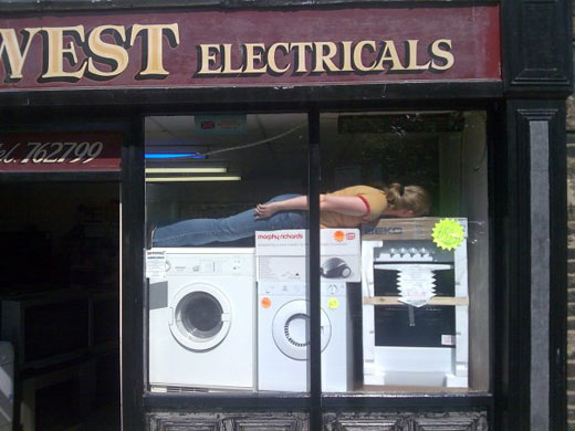 Facedown: Facebook lying down game in the electrical shop