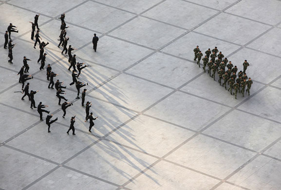 24 hours in pictures: Chinese army troops do their morning exercise