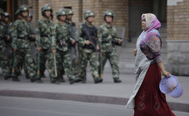 Dan Chung in Urumqi: Security forces on patrol near a mosque in Urumqi