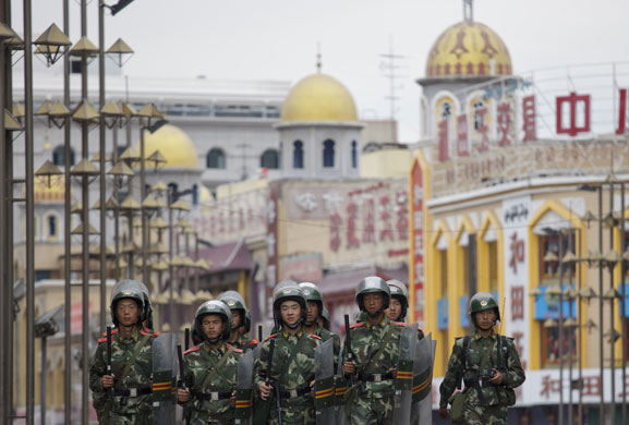 Dan Chung in Urumqi: Security forces on patrol near a mosque