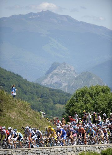 Tour de France : The pack of riders cycles in the Pyrenees mountains