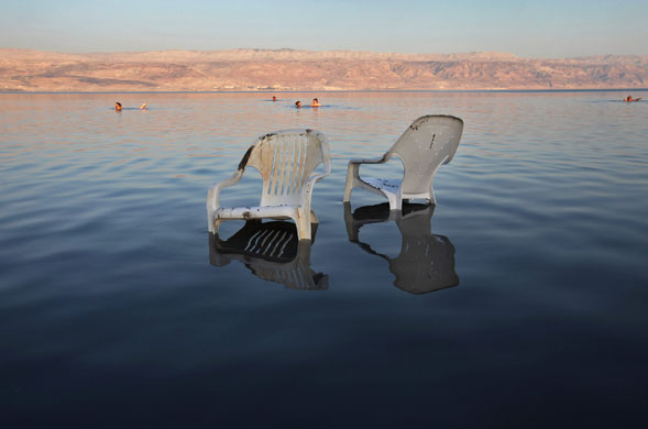 13 July 1009: : Kalia, Gaza: Plastic chairs are left in the waters of the northern Dead Sea