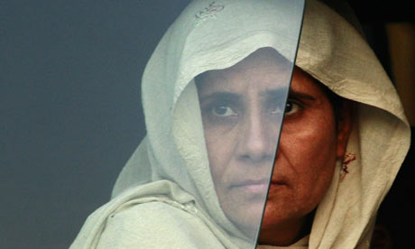 A dispalced woman returning home to the Swat Valley region of Pakistan
