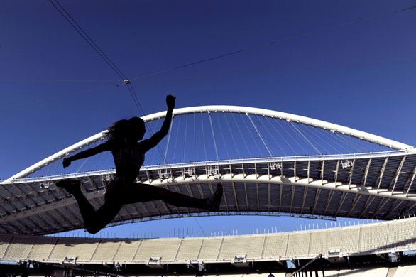 24sport: An athlete is seen in silhouette as she competes in the women's triple jump