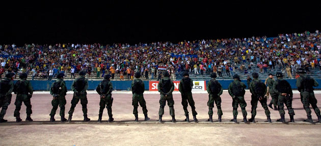 24sport: Riot policemen line up during a friendly football match in Baghdad