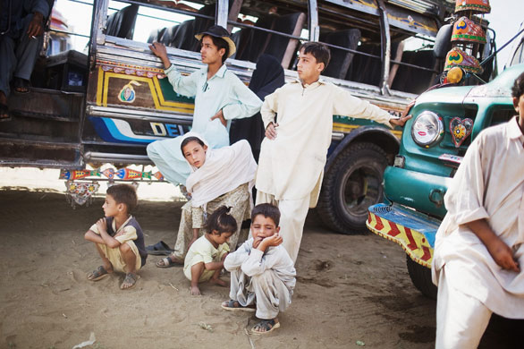 Refugees return to Swat: A family wait to depart from the Yar Hussain UNHCR camp