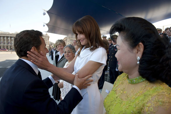 Bastille Day: Nicolas Sarkozy speaks to his wife Carla Bruni-Sarkozy