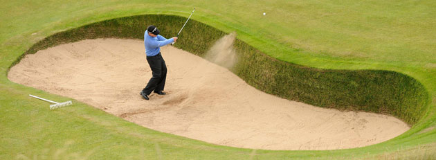24sport: Tom Watson of the U.S hits out of the greenside bunker 