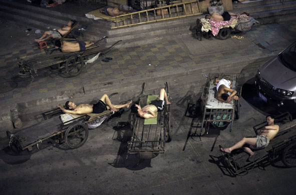 15 July 2009: Wuhan, China: Migrant workers sleep outdoors