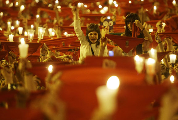 15 July 2009: Pamplona, Spain: Revellers during the closing ceremony of San Fermin