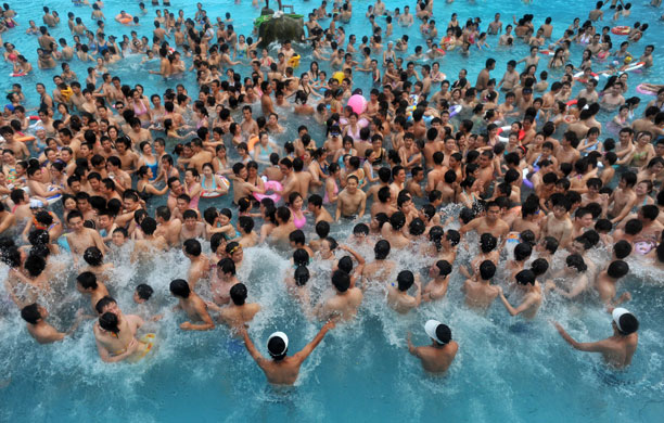 15 July 2009: Wuhan, China: People enjoy the water in a swimming centre