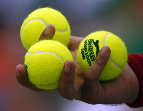 Week in Business: Fernando Verdasco of Spain holds three Slazenger tennis balls 